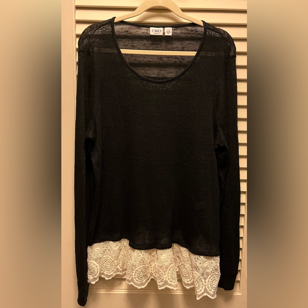 CATO Woman 22/24 Black sweater, white ruffle on the bottom hem. Long sleeve.